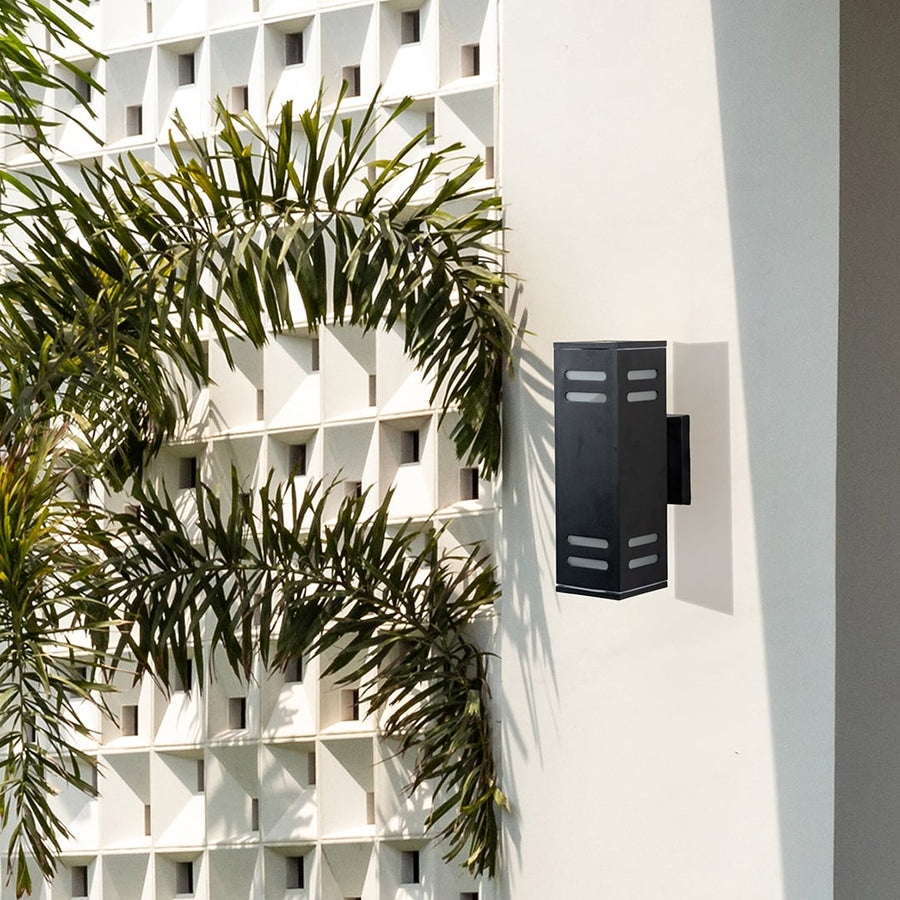 Contemporary outdoor black rectangular wall light enhancing entryways with subtle warm illumination and elegance.
