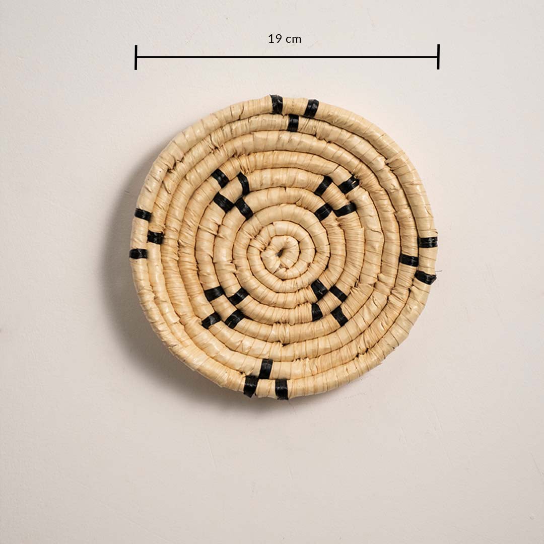 Small round woven wall basket measuring 19 cm in diameter featuring natural beige coils and black accents displayed on a white background.