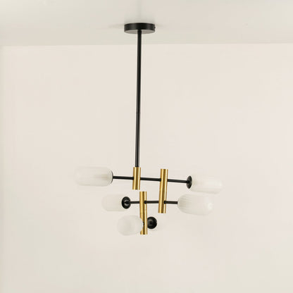 Gold and black metal chandelier with frosted glass tube shades designed for stylish modern ceiling lighting indoors.