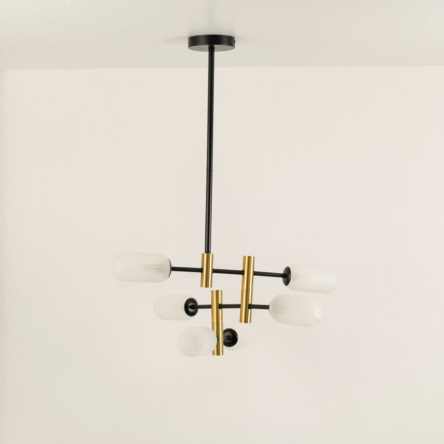 Gold and black metal chandelier with frosted glass tube shades designed for stylish modern ceiling lighting indoors.