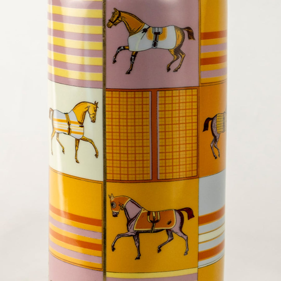 Tall gold ceramic jar with horse artwork and geometric patterns shown in a closeup view displaying vivid detailing artistic elegance and premium décor appeal for luxury interior styling.