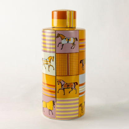 Amber ceramic decorative jar with striped pattern and gold lid for luxury tabletop styling and modern home decor.