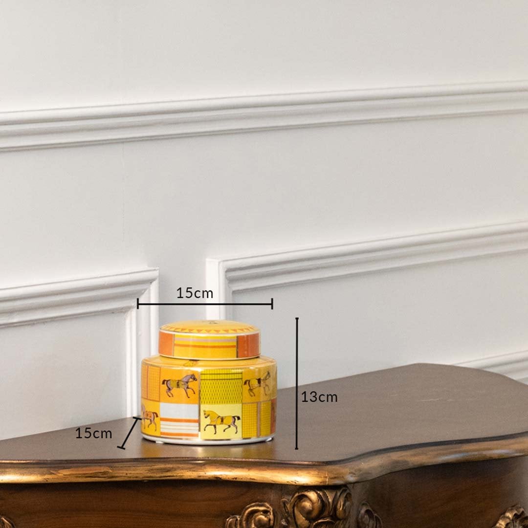 Small yellow ceramic jar with horse artwork in a front view measuring 9.5 cm width and 15 cm height ideal for decorative tabletop styling.