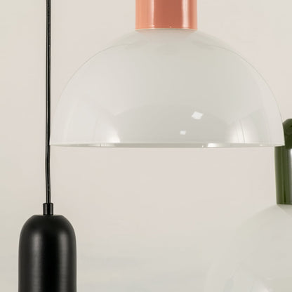 Black and white metal pendant light suspended above dining area adding modern decorative lighting to stylish interiors.