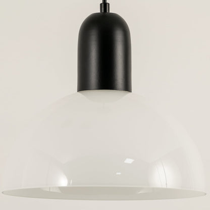 Black and white metal pendant light illuminated to display contemporary ceiling lighting with minimalist modern styling.