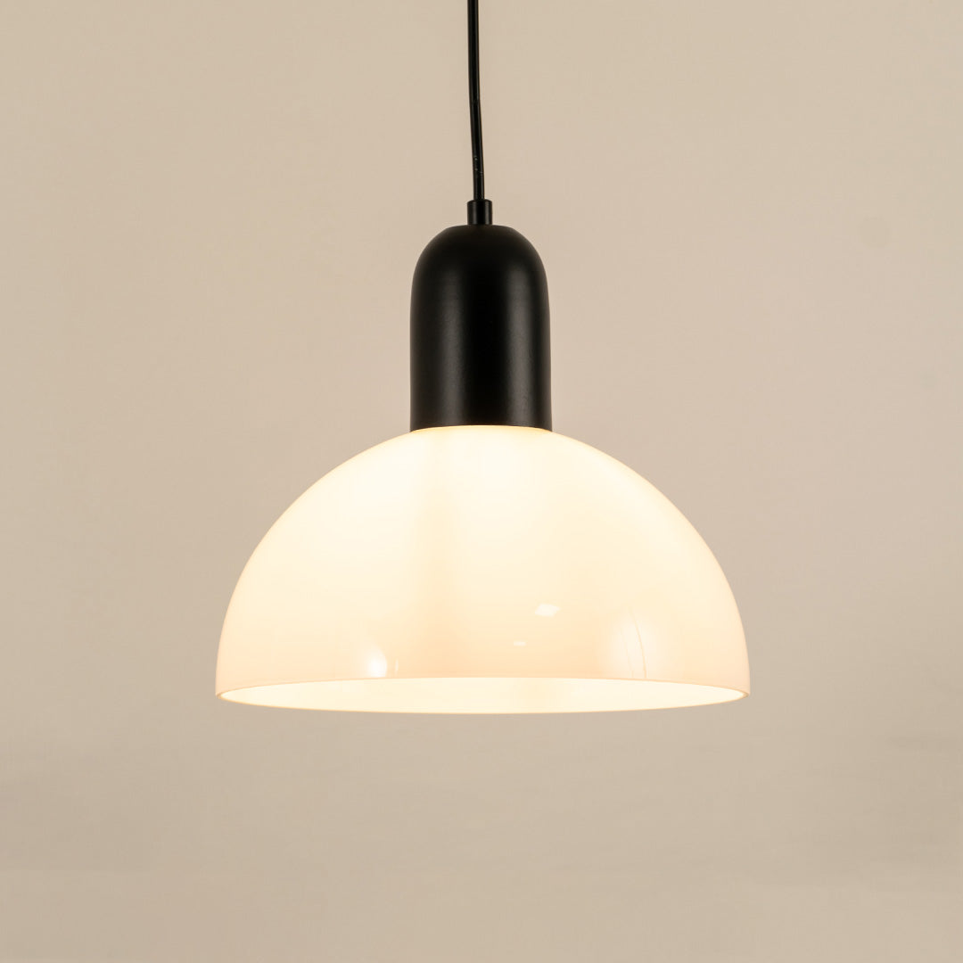Modern black and white pendant light hanging in stylish dining room and contemporary kitchen decor styling.