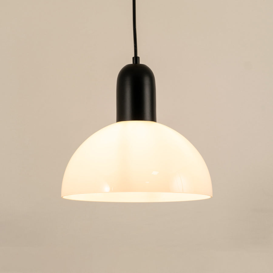 Modern black and white pendant light hanging in stylish dining room and contemporary kitchen decor styling.