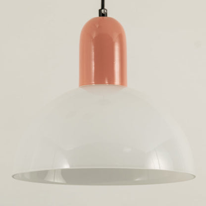 A closeup of dome pendant light with a soft peach top shown in close view against a smooth beige background creating gentle ambient lighting and elegant décor.