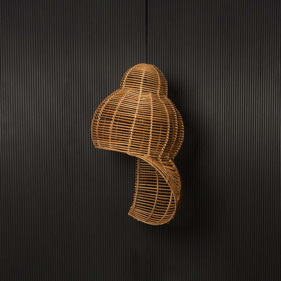 Double gourd rattan pendant light with bamboo frame in natural finish turned off against black background.