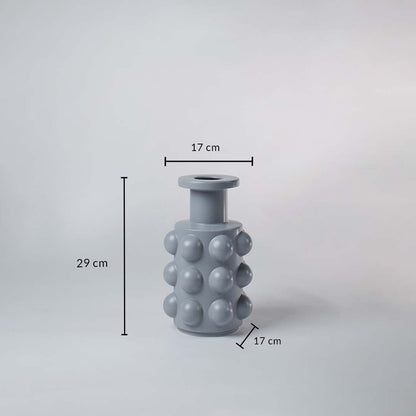 A grey textured vase shown with size details measuring 29 cm height and 17 cm width offering a clear understanding of its full dimensions.