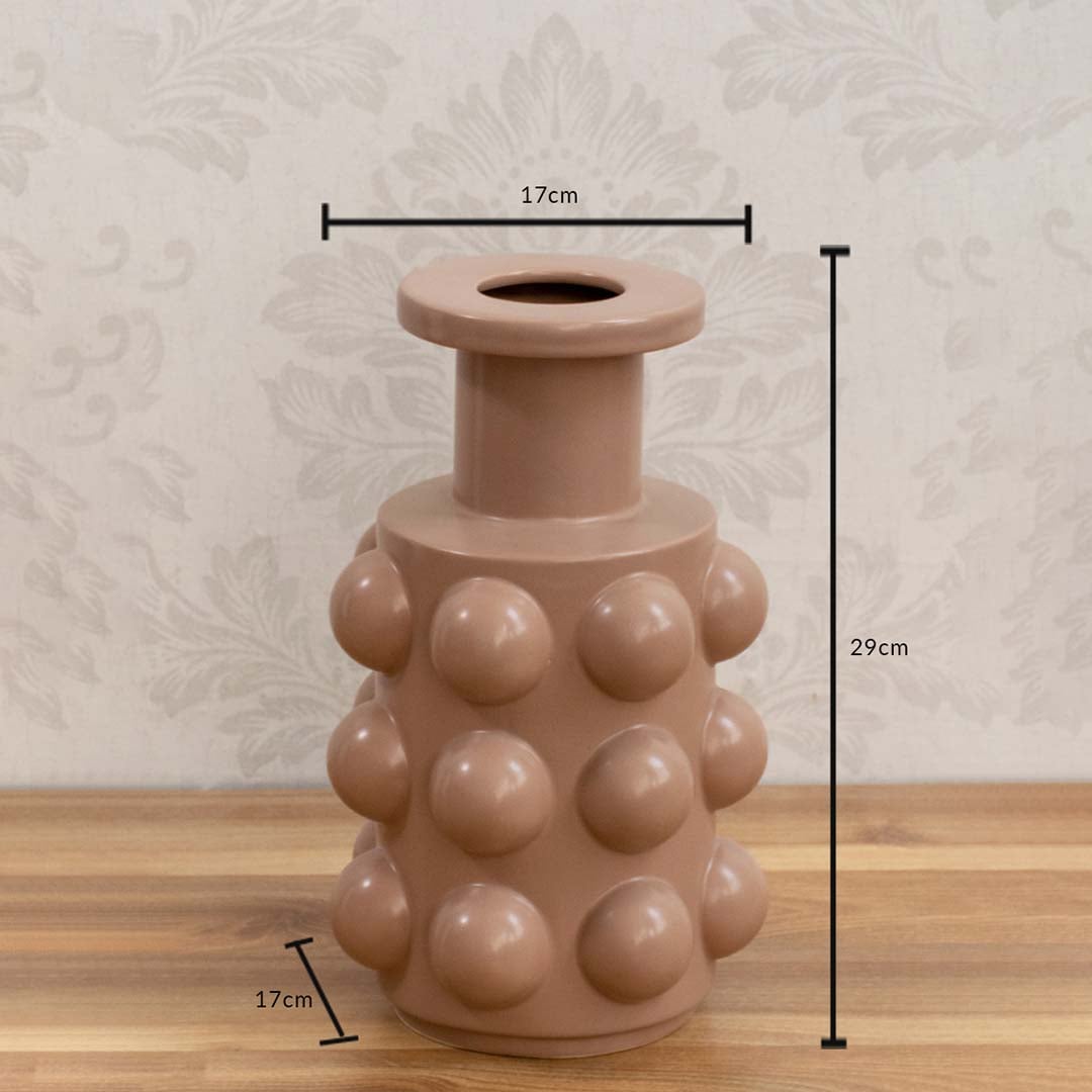A beige sculptural vase with raised rounded details shown with size measurements of 29 cm height and 17 cm width to provide clear dimensions.