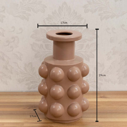 A beige sculptural vase with raised rounded details shown with size measurements of 29 cm height and 17 cm width to provide clear dimensions.