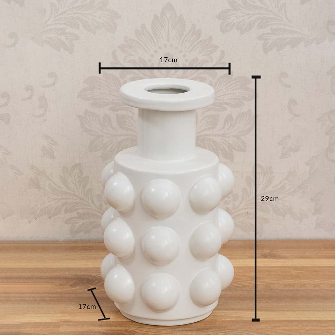 White ceramic vase measuring 29 cm in height and 17 cm in diameter with a glossy spherical textured surface.