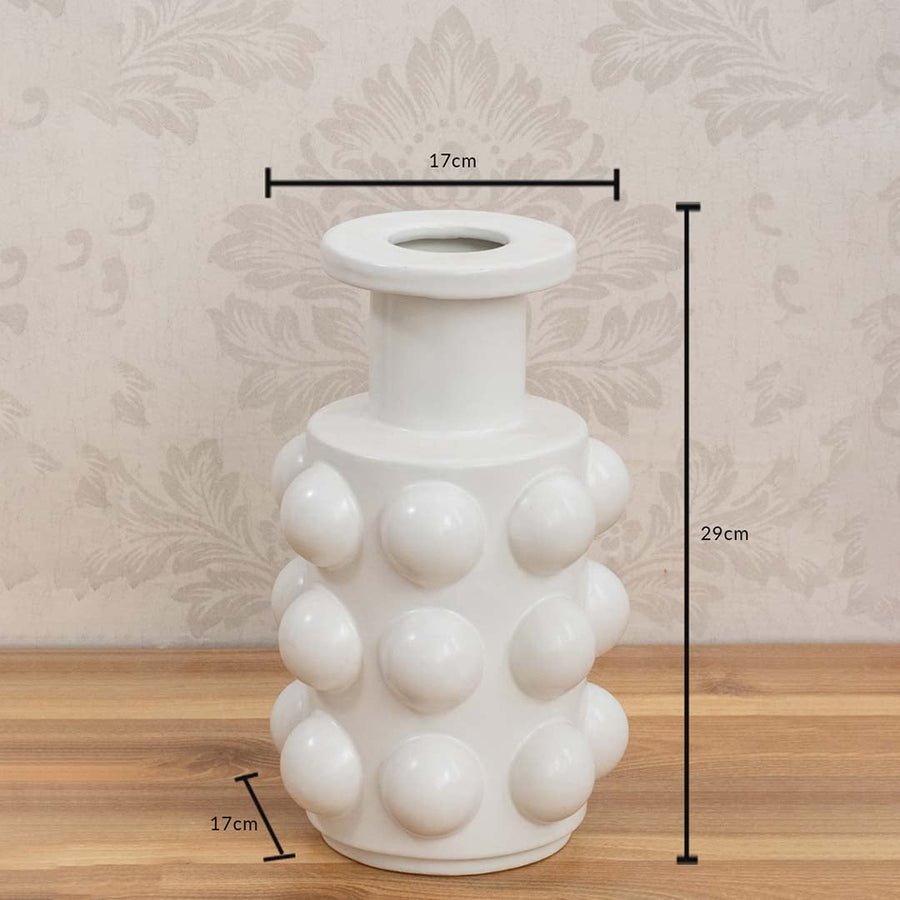 White ceramic vase measuring 29 cm in height and 17 cm in diameter with a glossy spherical textured surface.