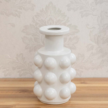 Sculptural white bubble ceramic vase with round embossed design and glossy finish for modern home interiors.