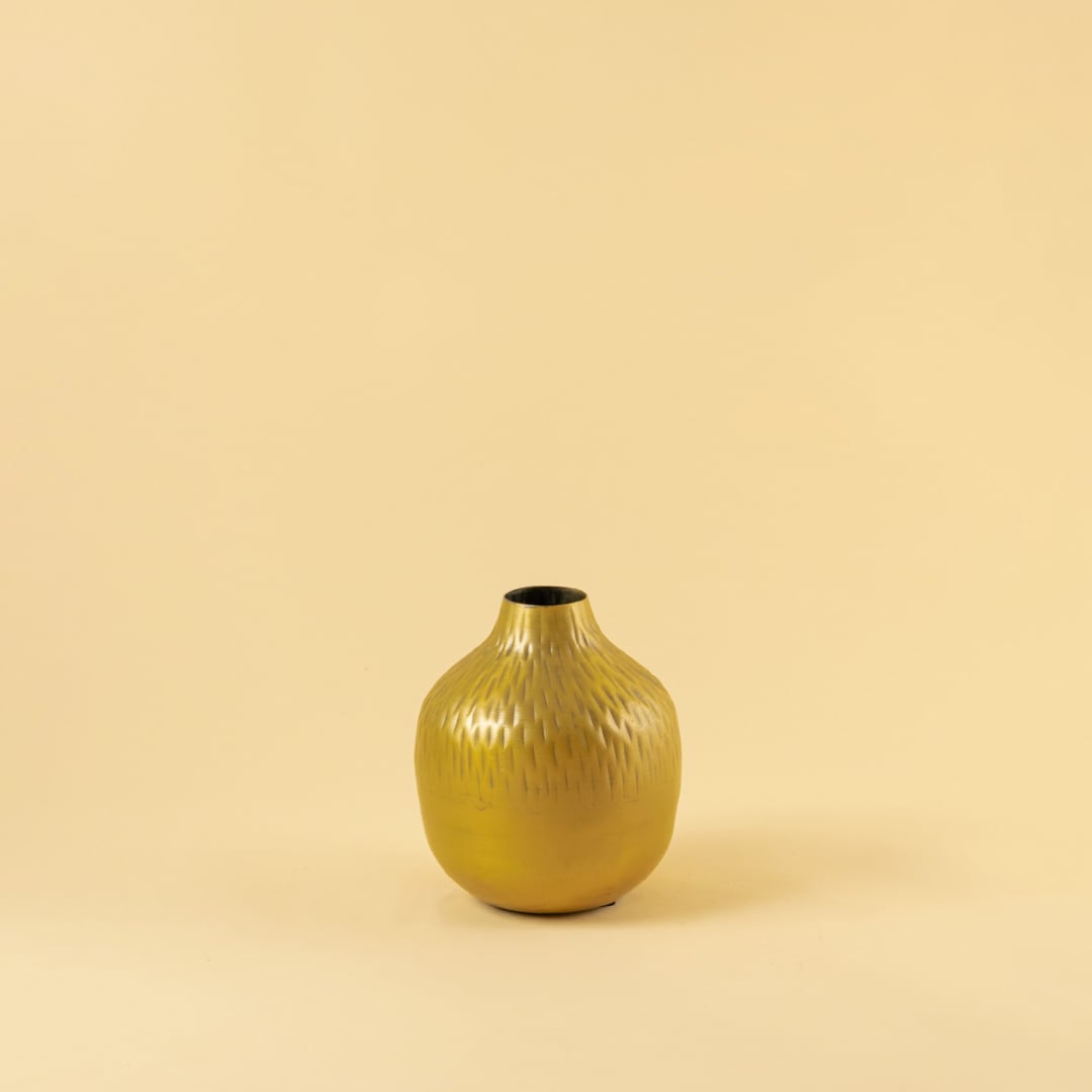 Gold hammered metal vase decor on a clean white background perfect for modern shelves console tables and simple elegant decor.