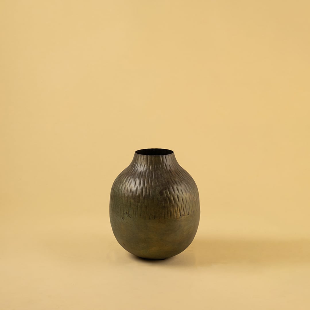 Brown hammered metal vase decor on clean white background ideal for modern shelves consoles and tabletop styling.