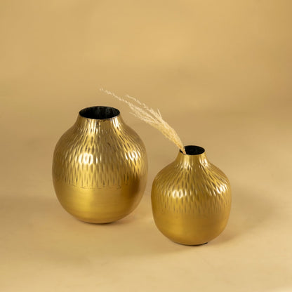 Gold hammered metal vase decor shown with matching pieces for a warm modern display on shelves console tables and styling areas.