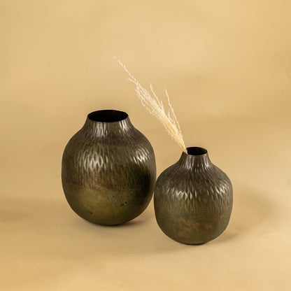 Brown hammered metal vase decor paired with matching pieces creating an earthy modern accent for shelves and living room styling.