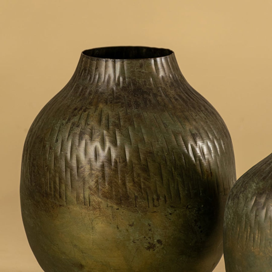 Brown hammered metal vase closeup showing textured hammered finish ideal for modern living room consoles and tabletop decor.
