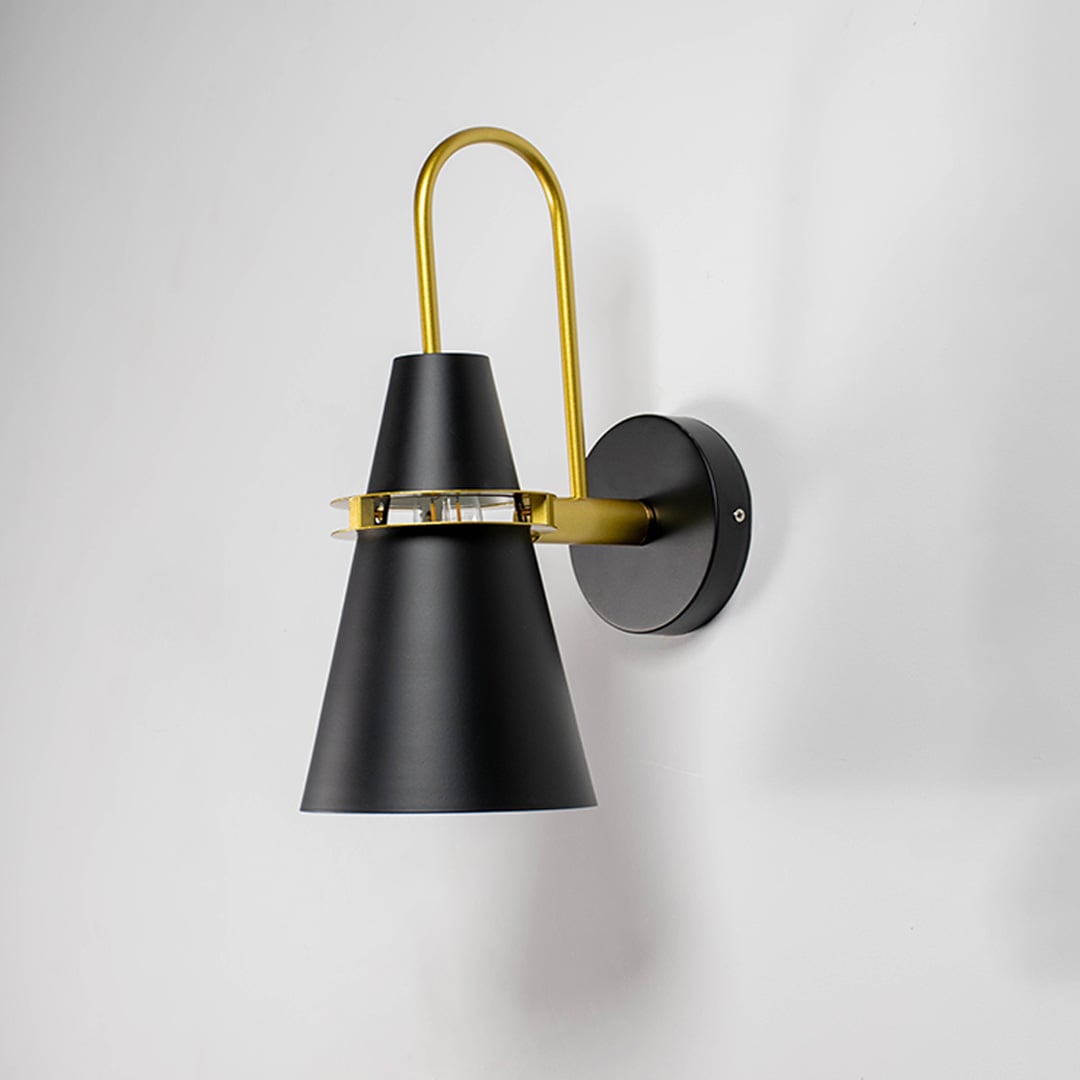 Matte black and gold conical wall light displayed on white background perfect for minimalist home lighting.