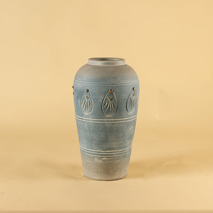 Blue carved terracotta vase with smooth handmade finish displayed on a clean white background perfect for modern artistic home decor styling.
