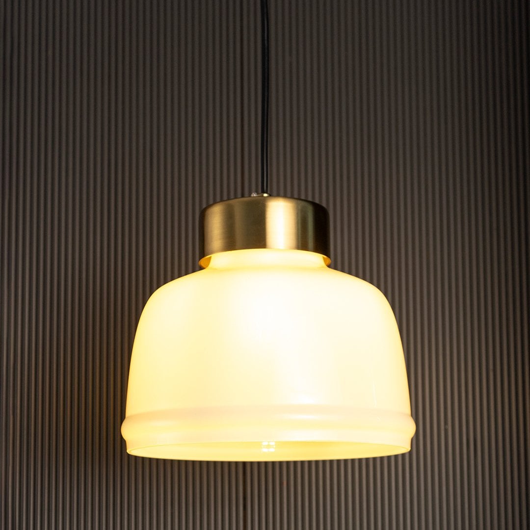 Sleek Dome Brass Milk White Pendant Light On Black Background