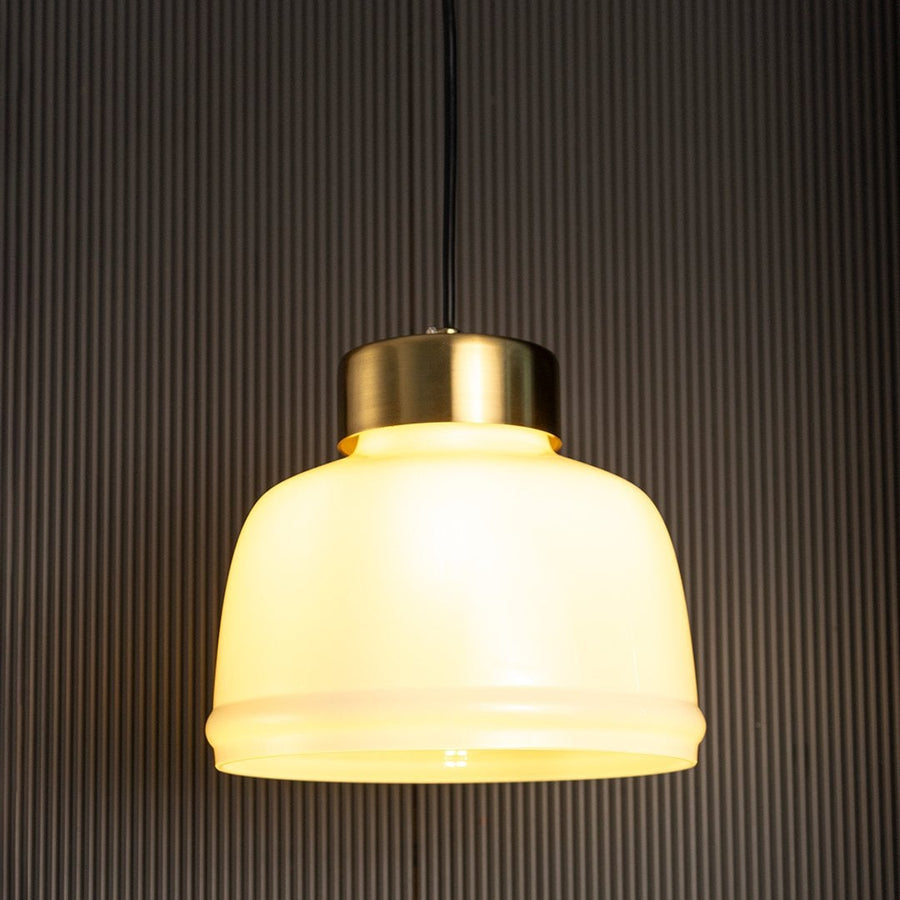 Sleek Dome Brass Milk White Pendant Light On Black Background