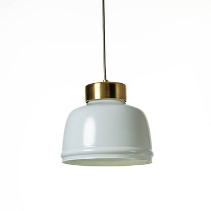 Frosted glass pendant light turned off with minimal white shade and brushed gold top displayed against white background.