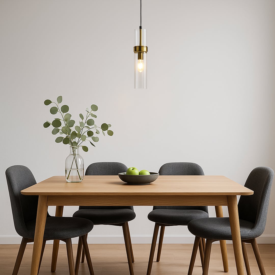 Elegant glass pendant light with warm glow hanging above a modern wooden dining table in a minimal room creating a calm and inviting ambience.