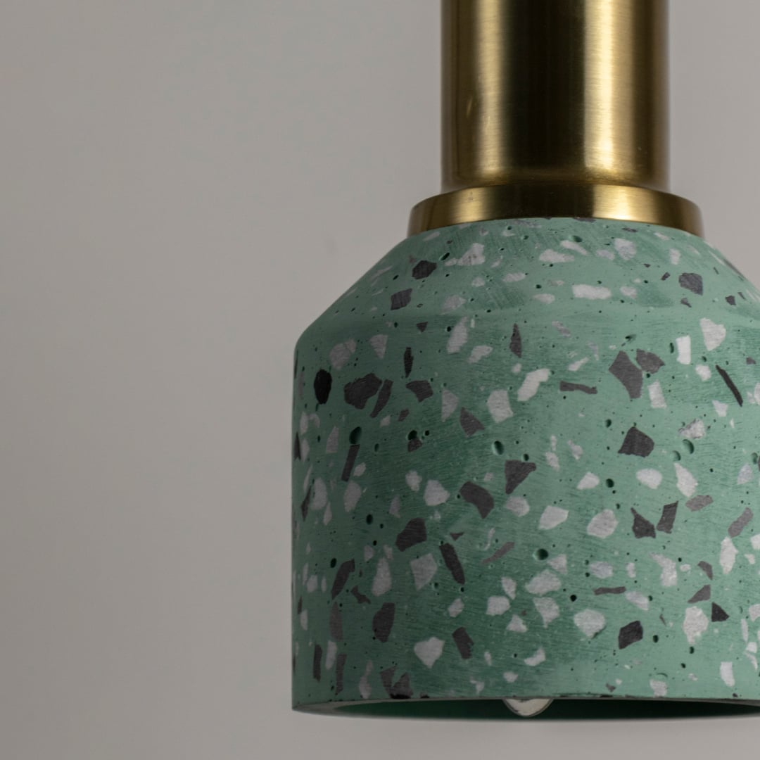 Closeup of mint green terrazzo pendant light showcasing premium stone texture and refined craftsmanship.