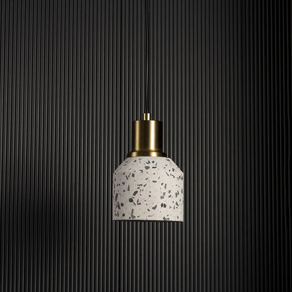White speckled ceramic pendant light shown unlit on black background creating modern minimalist ceiling lighting appeal.