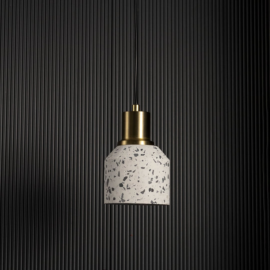 White speckled ceramic pendant light shown unlit on black background creating modern minimalist ceiling lighting appeal.