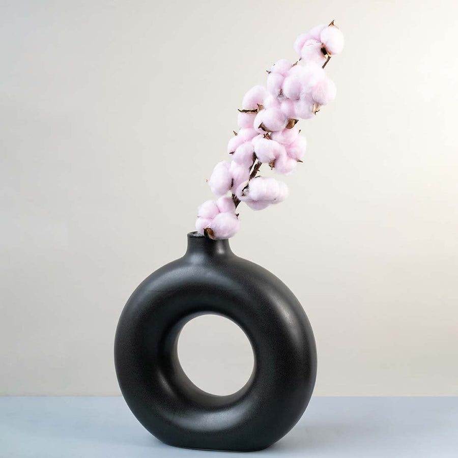 Pink cotton stem preserved artificial floral decor lifestyle display on white background for modern interiors.