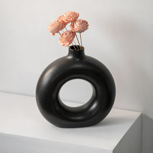 Artificial sola flower bouquet in peach shade styled in a contemporary living room for premium interior decoration.