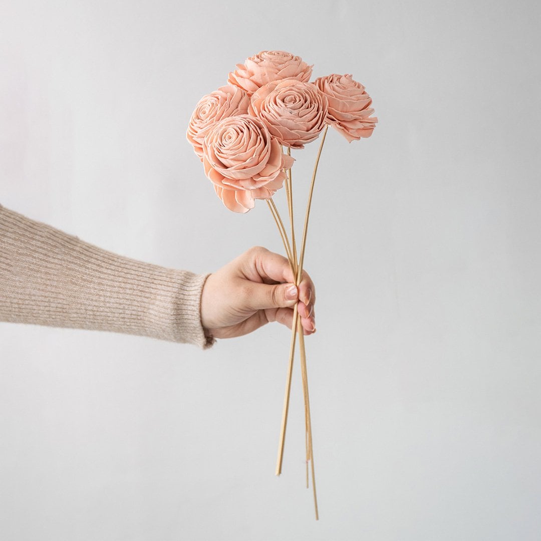 Five peach sola flower with stems on a plain white background for minimalist artificial floral styling.