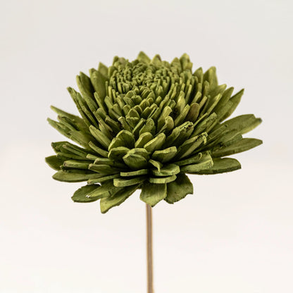 Zoomed-in view of artificial green chrysanthemum flower head with lifelike detailing for home decor.