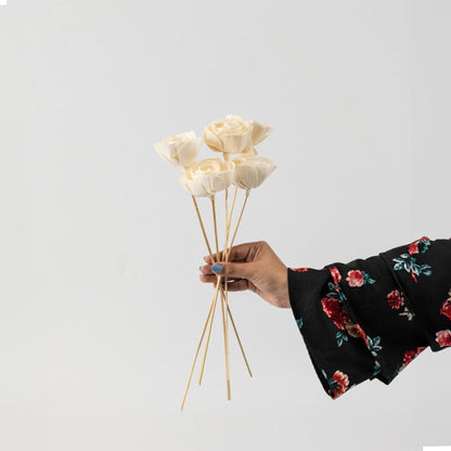 Set of multiple white flower sticks arranged together for a coordinated floral display on White Background.