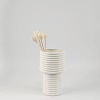 Tulip sola wood flower stick in ivory styled in ceramic vase for modern home decoration and elegant interior styling.