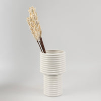 Sola decorative stick with ivory flower buds styled in modern ceramic vase for elegant home decor and interior styling.
