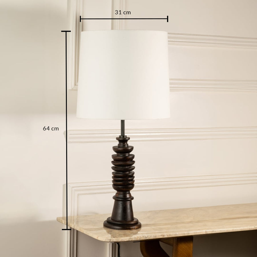 Dark wood table lamp with white fabric shade measuring 64 cm height and 31 cm width for classic interior decor.
