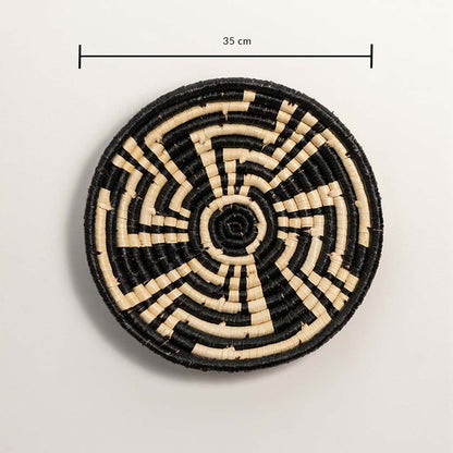Medium round woven wall basket measuring 35 cm in diameter featuring natural beige coils and black accents displayed on white.