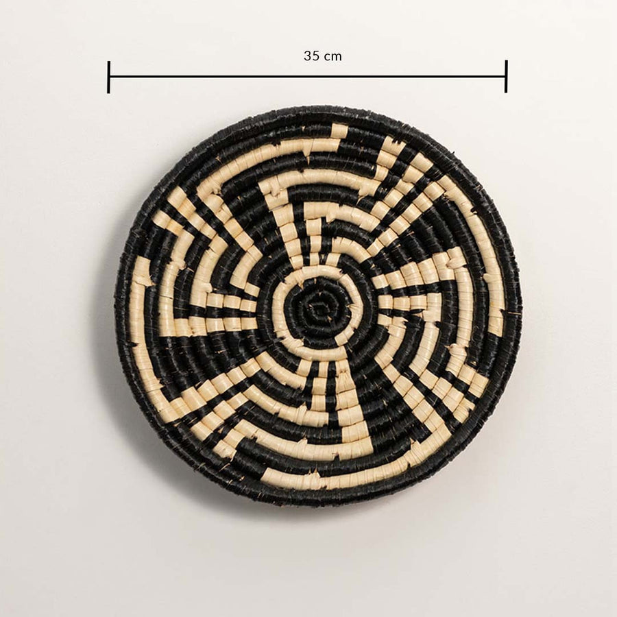 Medium round woven wall basket measuring 35 cm in diameter featuring natural beige coils and black accents displayed on white.