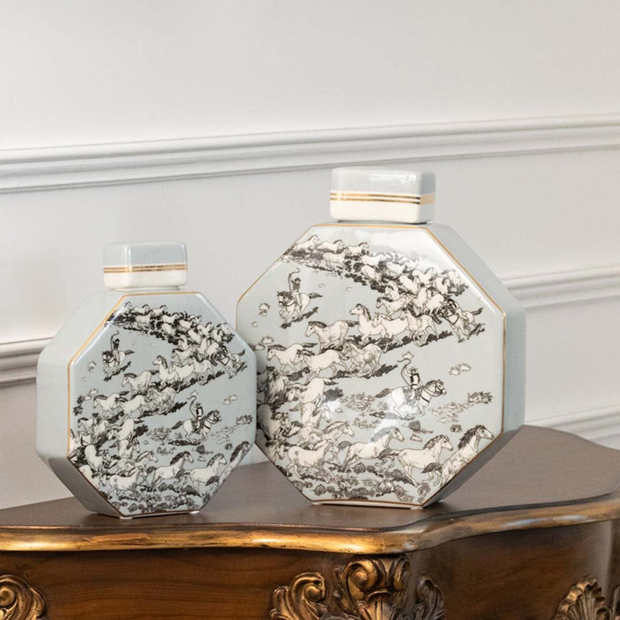 Ceramic jars with grey floral detailing perfect for subtle living room décor and elegant tabletop placement.