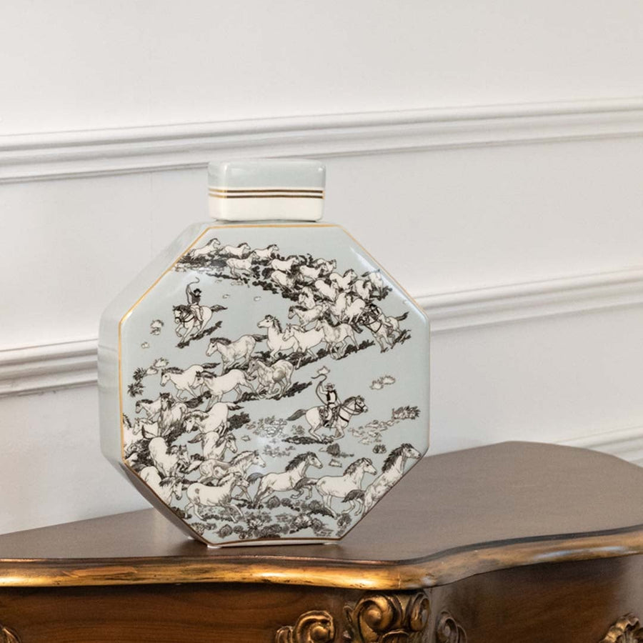 Ceramic jar decorated with detailed grey scenic artwork shown in a closeup view highlighting fine lines depth and texture creating a traditional handpainted décor accent for classic interiors.