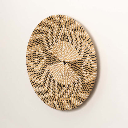 Side profile of round woven seagrass basket showing depth handwoven edges and sturdy natural fiber build.