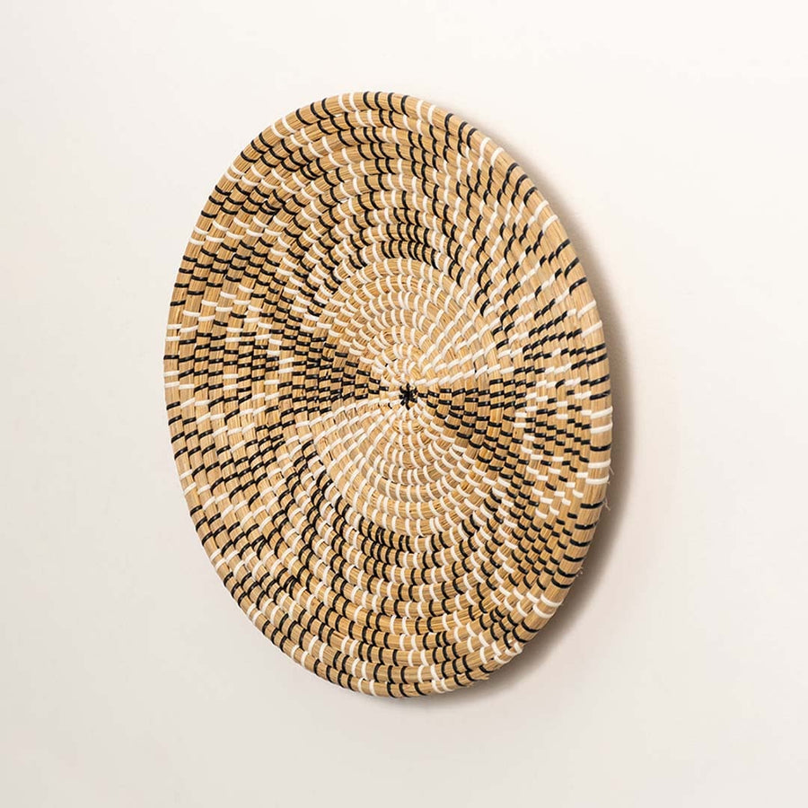 Side profile of round woven seagrass basket showing depth handwoven edges and sturdy natural fiber build.