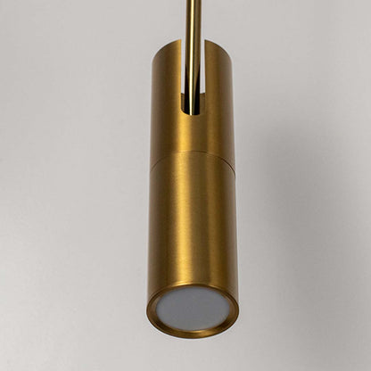 Closeup of modern gold cylindrical pendant light with metallic finish stylish ceiling lamp for luxury home interior lighting.