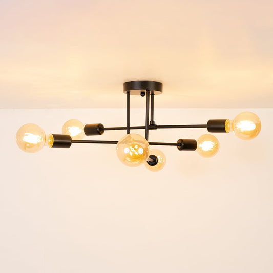 Black modern chandelier glowing warmly on white background showcasing sleek metal rods and round bulbs for elegant home lighting.