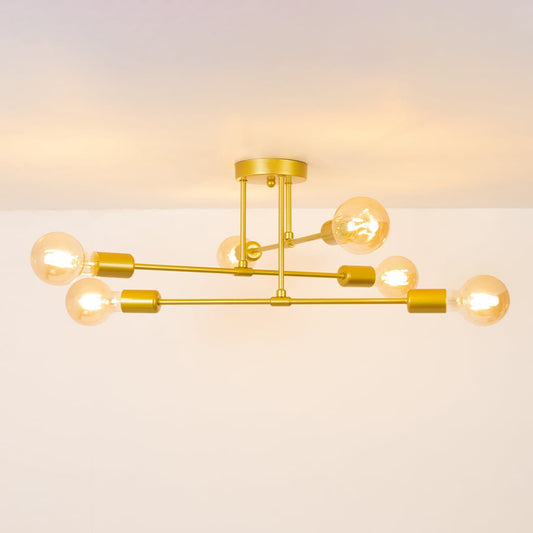 Gold chandelier glowing softly on a white background showcasing its warm illuminated bulbs and clean modern structure